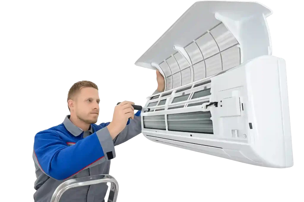 AC technician cleaning indoor air conditioner unit.