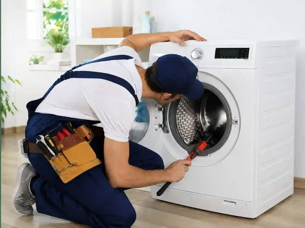 Technician performing Washing Machine Repair in Bahrain and appliance maintenance.